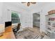 Inviting home office with natural light, a built-in bookcase, and comfortable seating at 909 143Rd Ne St, Bradenton, FL 34212