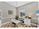 Office featuring built-in shelves and cabinets, a large window, and a ceiling fan at 909 143Rd Ne St, Bradenton, FL 34212