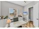 Office with desk, chair, built-in storage, and view to outside at 909 143Rd Ne St, Bradenton, FL 34212