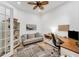 Well-lit home office with a large desk, comfortable seating, and neutral decor at 909 143Rd Ne St, Bradenton, FL 34212