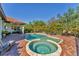 Beautiful backyard oasis with a sparkling pool, spa, and covered patio, perfect for outdoor entertaining at 909 143Rd Ne St, Bradenton, FL 34212