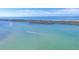 Scenic aerial view of the water and a boat's wake as it glides across the tranquil ocean at 9203 Griggs Rd # B102, Englewood, FL 34224