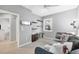 Cozy bedroom featuring a built-in desk, shelving, and a comfortable daybed with flamingo pillows at 9203 Griggs Rd # B102, Englewood, FL 34224