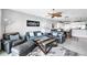 Relaxing living room with modern furniture, a ceiling fan, and an open layout to the kitchen at 9203 Griggs Rd # B102, Englewood, FL 34224