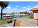 View of backyard with beautiful waterfront and dock with boat at 9619 Valencia Cv, Bradenton, FL 34210