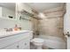 Updated bathroom featuring a shower with glass door, and tile surround at 9619 Valencia Cv, Bradenton, FL 34210
