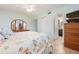This bedroom features an ensuite bathroom and closet, providing a private retreat with ample storage space at 9619 Valencia Cv, Bradenton, FL 34210