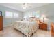 Inviting bedroom with natural light, tile flooring, and coordinated furnishings at 9619 Valencia Cv, Bradenton, FL 34210
