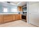 Bright kitchen with stainless steel appliances, maple cabinets, and tile backsplash at 9619 Valencia Cv, Bradenton, FL 34210