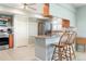 Well-equipped kitchen with stainless steel appliances and breakfast bar seating at 9619 Valencia Cv, Bradenton, FL 34210