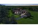 Aerial view of this stunning luxury estate with lush landscaping, mature trees, circular driveway, and well-manicured lawn at 1110 79Th E St, Palmetto, FL 34221
