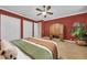 Spacious bedroom with a ceiling fan, large armoire, and double door closets at 1110 79Th E St, Palmetto, FL 34221