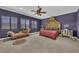 Bedroom featuring a bed with canopy, chaise lounge, ceiling fan, and shuttered windows at 1110 79Th E St, Palmetto, FL 34221