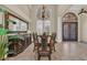 Elegant dining room with a large table, ornate chandelier, and custom mirror, ideal for hosting gatherings at 1110 79Th E St, Palmetto, FL 34221