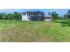 Exterior shot of screened enclosure with private pool and spacious grassy yard at 1110 79Th E St, Palmetto, FL 34221