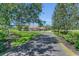 Long driveway to home with landscaped front yard at 1110 79Th E St, Palmetto, FL 34221
