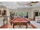 The game room features a pool table, comfortable seating, and an open floor plan at 1110 79Th E St, Palmetto, FL 34221