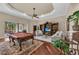 The game room features a pool table, comfortable seating, and access to the outdoor living area at 1110 79Th E St, Palmetto, FL 34221