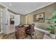 Comfortable home office featuring built-in desk, natural light, and modern decor offers a functional workspace at 1110 79Th E St, Palmetto, FL 34221