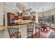 The eat-in kitchen features a center island with bar seating and views of the backyard at 1110 79Th E St, Palmetto, FL 34221