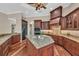 Gourmet kitchen features a center island, granite countertops, and stainless steel appliances at 1110 79Th E St, Palmetto, FL 34221