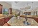 Open-concept kitchen with a large island, granite countertops, and seamless flow into the living and dining areas at 1110 79Th E St, Palmetto, FL 34221