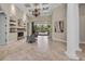 Spacious living room featuring a fireplace, tile floors, and views of the outdoor pool at 1110 79Th E St, Palmetto, FL 34221