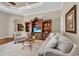 Comfortable living room featuring a large entertainment center, decorative rug, and lots of light at 1110 79Th E St, Palmetto, FL 34221