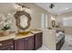 The main bathroom has double sinks, a garden tub, and decorative fixtures at 1110 79Th E St, Palmetto, FL 34221