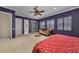 Spacious primary bedroom with a ceiling fan, lounge, and multiple windows at 1110 79Th E St, Palmetto, FL 34221