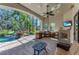 Outdoor patio with kitchen, grill, fireplace, seating area, and pool view at 1110 79Th E St, Palmetto, FL 34221