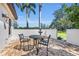 Outdoor patio with brick pavers, seating, and tropical landscaping offers a relaxing space to enjoy the outdoors at 1110 79Th E St, Palmetto, FL 34221