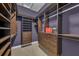 A large walk-in closet that includes shelving and drawers for plenty of storage at 1110 79Th E St, Palmetto, FL 34221