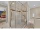 Walk-in shower featuring decorative tile work, a glass door, and dual shower heads at 1110 79Th E St, Palmetto, FL 34221