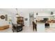 Well lit dining area with dark wood table, decorative lighting fixture, and tile flooring at 1118 Deardon Dr, Venice, FL 34292