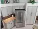 Well-designed kitchen featuring stainless steel refrigerator, ample cabinet space, and modern finishes at 1118 Deardon Dr, Venice, FL 34292