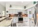 Modern kitchen with stainless steel appliances, granite countertops and tile backsplash at 1118 Deardon Dr, Venice, FL 34292
