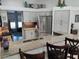 Open kitchen with granite countertops, stainless steel appliances, and a breakfast bar with seating at 1118 Deardon Dr, Venice, FL 34292