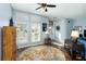 Inviting living room with hardwood floors and large windows with natural light at 1118 Deardon Dr, Venice, FL 34292
