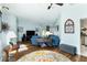 Comfortable living room featuring wood floors and a soothing blue color palette at 1118 Deardon Dr, Venice, FL 34292