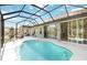 Relaxing screened-in pool area with ample space for lounging and entertaining at 1118 Deardon Dr, Venice, FL 34292