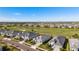 Stunning aerial view of a neighborhood with golf course, lake views, and beautifully landscaped homes at 15916 Sugar Hill Dr, Punta Gorda, FL 33982