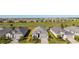 Aerial view of a community with well-maintained homes, landscaping, and golf course views at 15916 Sugar Hill Dr, Punta Gorda, FL 33982