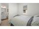 Bedroom featuring a bright window and an attached bathroom at 15916 Sugar Hill Dr, Punta Gorda, FL 33982