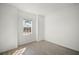 Minimalist bedroom featuring tile floors and bright natural light from the window at 15916 Sugar Hill Dr, Punta Gorda, FL 33982