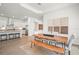 Bright dining area with an open floor plan, modern decor, and wooden table at 15916 Sugar Hill Dr, Punta Gorda, FL 33982