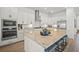 A gourmet kitchen featuring stainless steel appliances, granite countertops, and a large island at 15916 Sugar Hill Dr, Punta Gorda, FL 33982