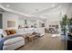 Spacious living area with ample seating, modern decor, and seamless flow to dining at 15916 Sugar Hill Dr, Punta Gorda, FL 33982
