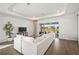 Living room showcasing an over-sized sofa and a slider leading to the lanai at 15916 Sugar Hill Dr, Punta Gorda, FL 33982