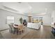 Sunlit living area featuring tile floors, modern decor, and an open floor plan at 15916 Sugar Hill Dr, Punta Gorda, FL 33982